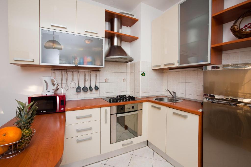 Kuchyň nebo kuchyňský kout v ubytování Apartment Di Anima