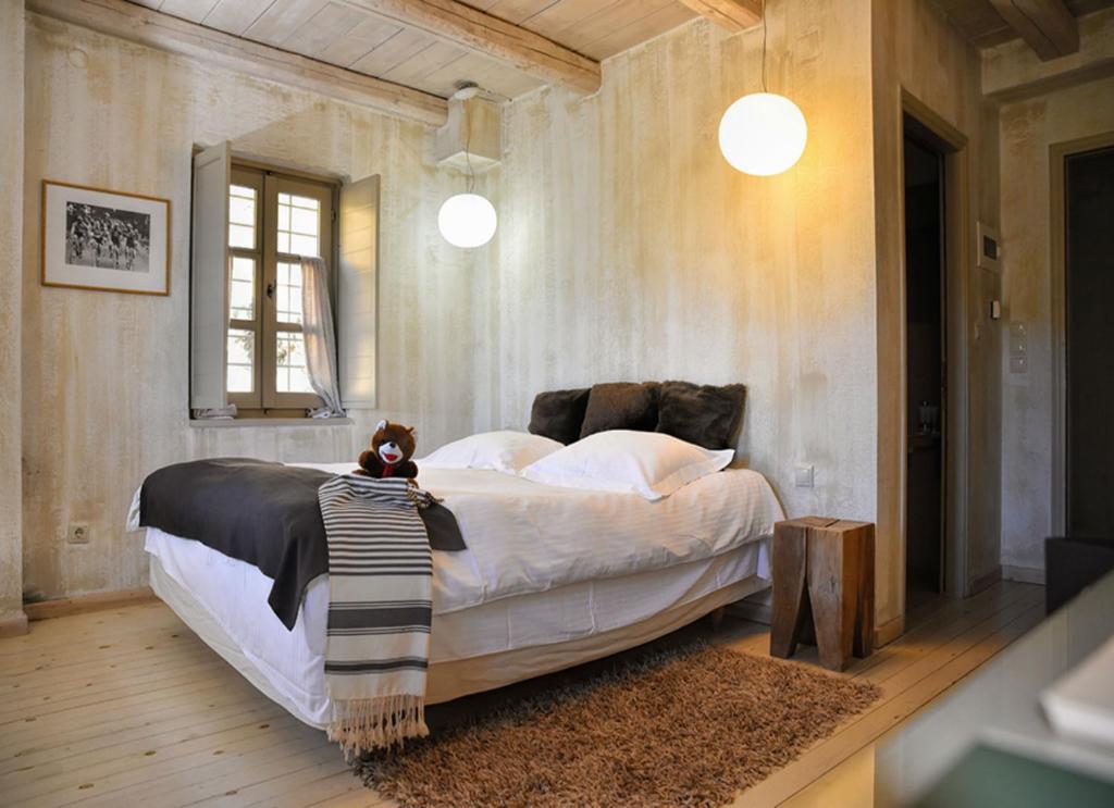 Postel nebo postele na pokoji v ubytování Mikro Papigo 1700 Hotel & Spa