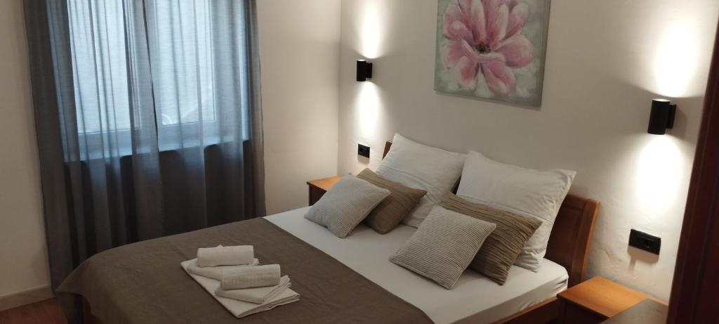 Postel nebo postele na pokoji v ubytování APARTMANI KUJUNDŽIĆ