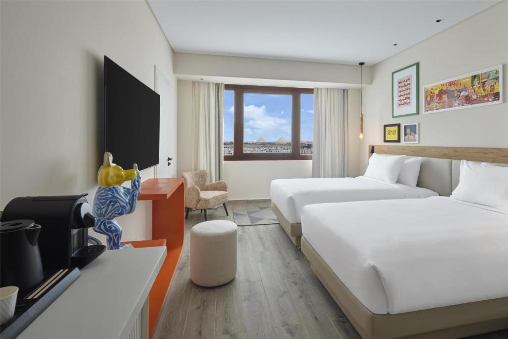 Voodi või voodid majutusasutuse Hyatt Centric Cairo West toas