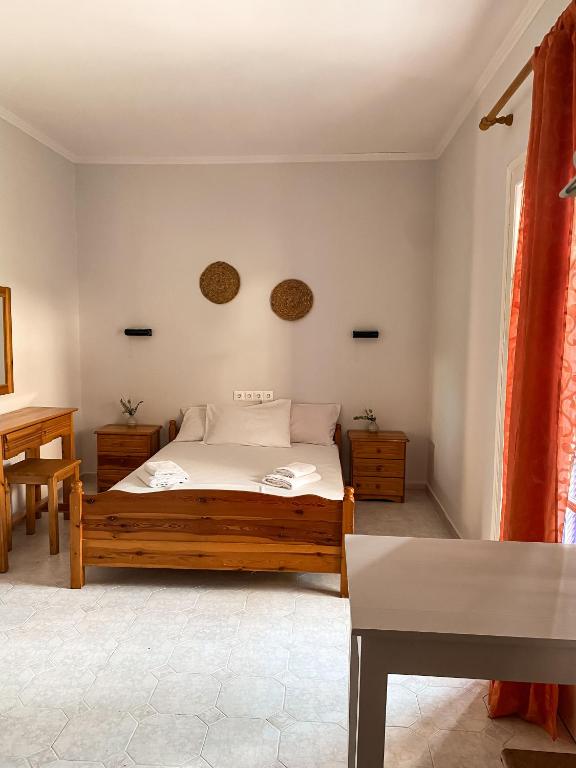 Postel nebo postele na pokoji v ubytování Faros Studios