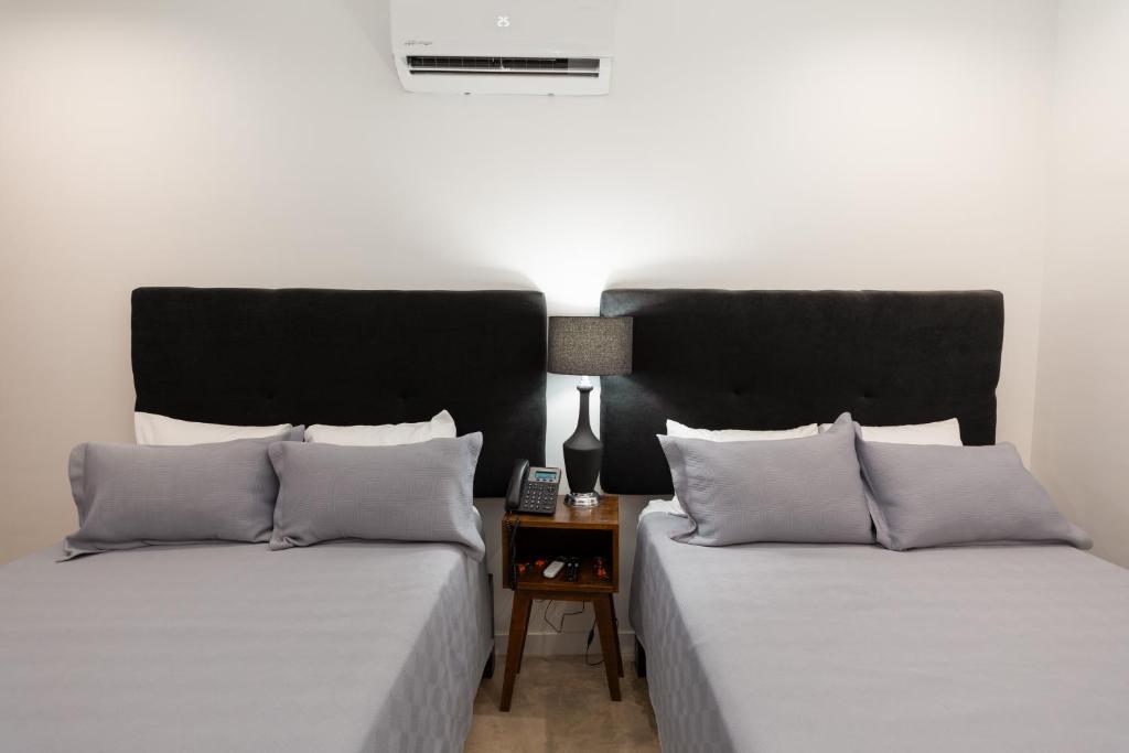 Postel nebo postele na pokoji v ubytování Hotel Manadia