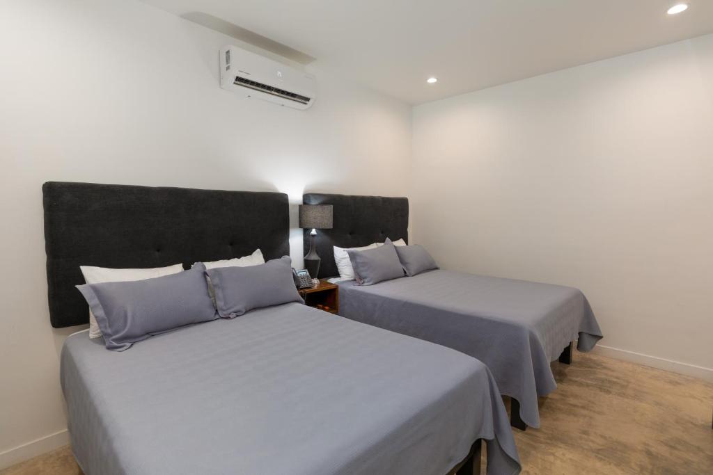 Postel nebo postele na pokoji v ubytování Hotel Manadia