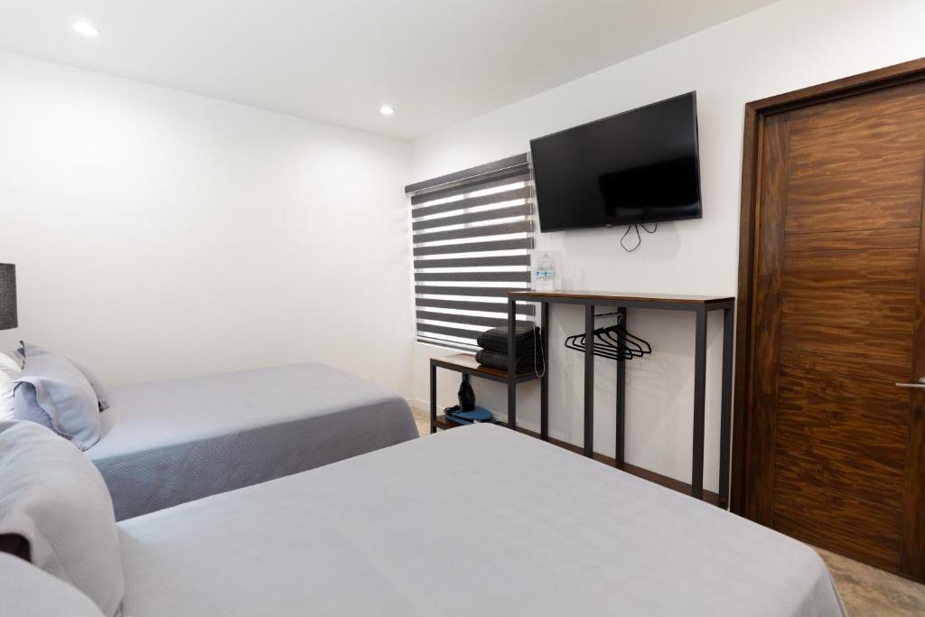 Postel nebo postele na pokoji v ubytování Hotel Manadia