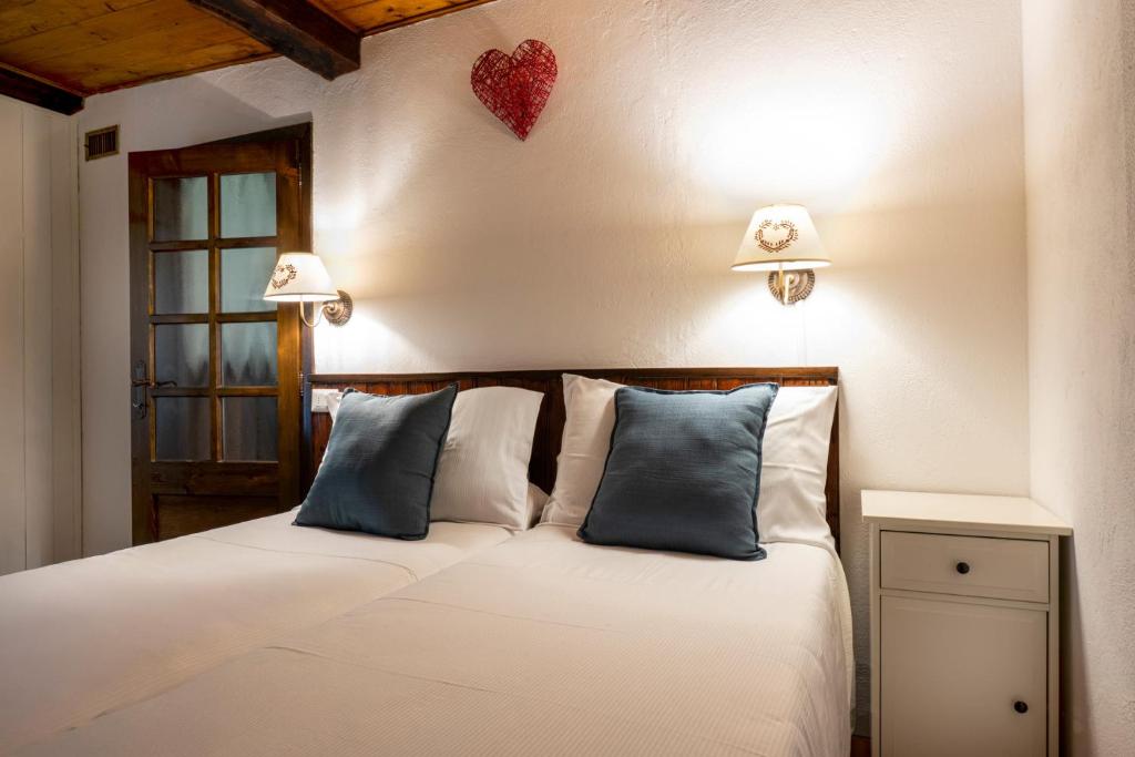 Rúm í herbergi á Chalet Casa dei Nonni
