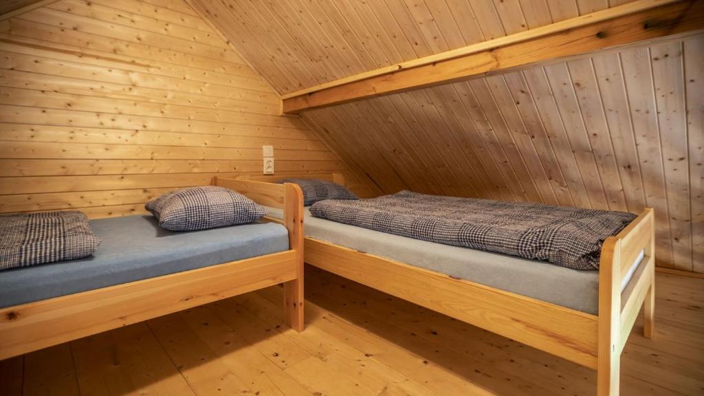 Postel nebo postele na pokoji v ubytování O.W.Cynamon