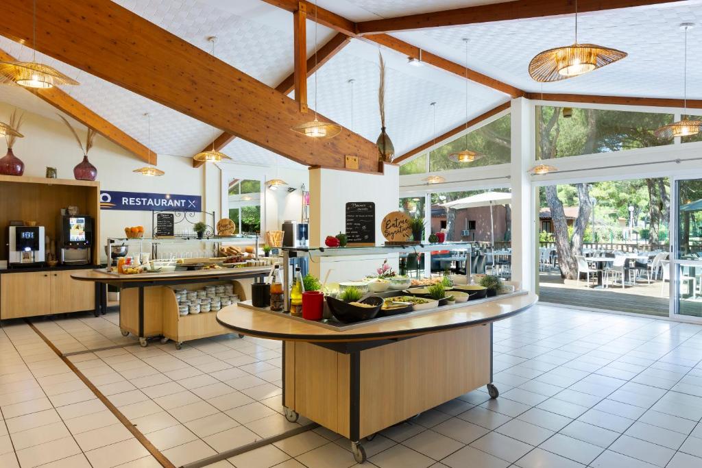 Reštaurácia alebo iné gastronomické zariadenie v ubytovaní SOWELL Family Cap d’Agde