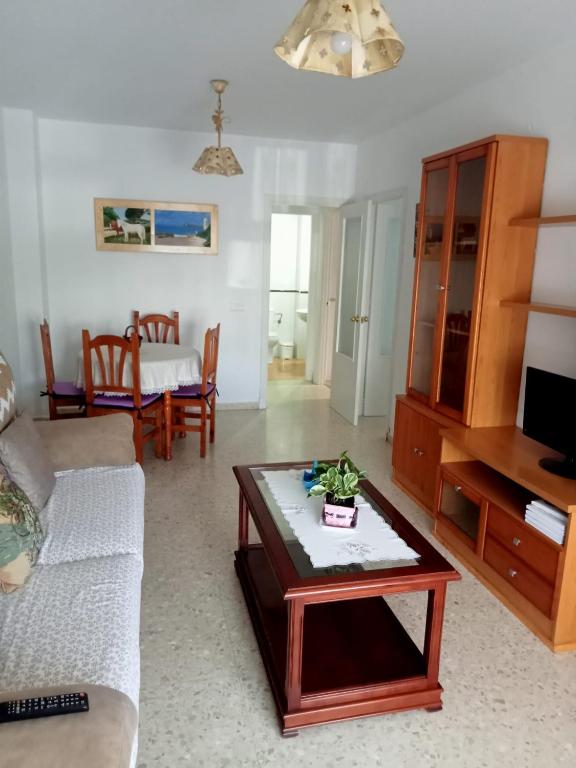 a living room with a couch and a coffee table at Casa Niebla in Vejer de la Frontera