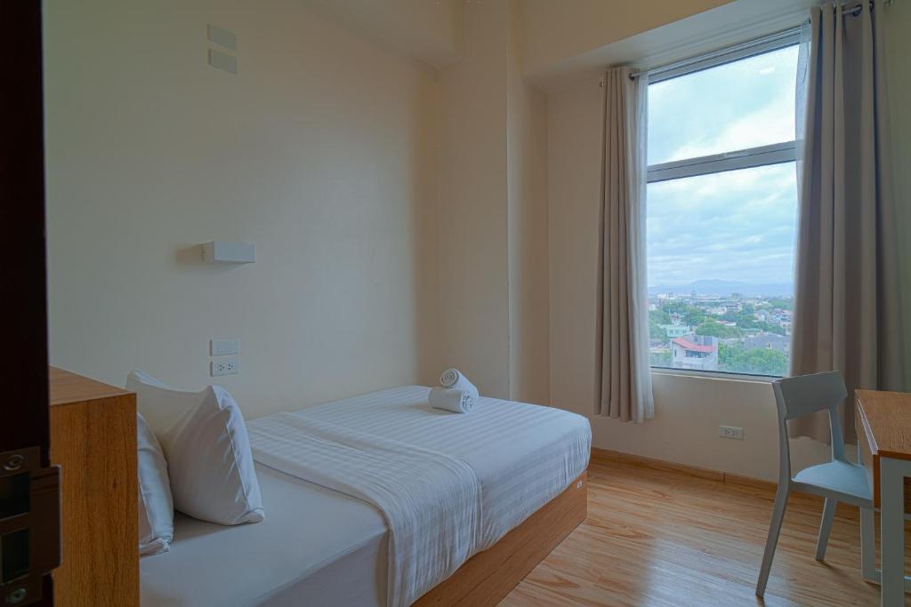 Letto o letti in una camera di MySpace Hotel Comembo Taguig