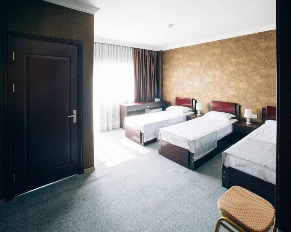 Postel nebo postele na pokoji v ubytování Hotel Rosa