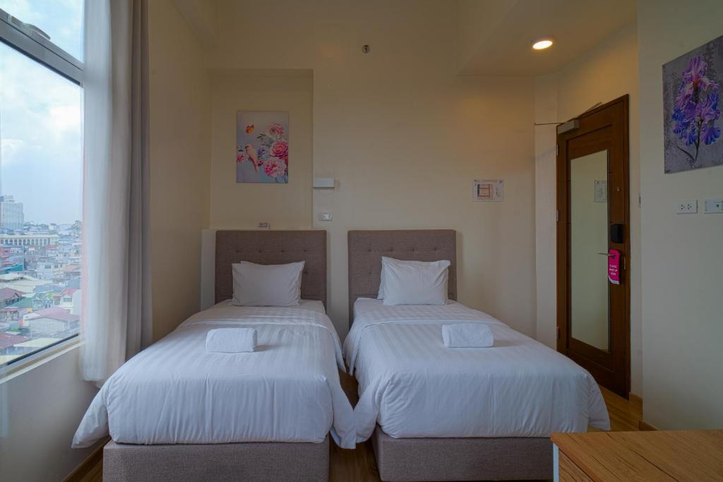 Letto o letti in una camera di MySpace Hotel Comembo Taguig