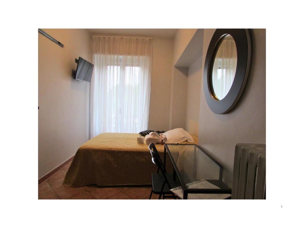 Postel nebo postele na pokoji v ubytování Hotel Ponte Sassi