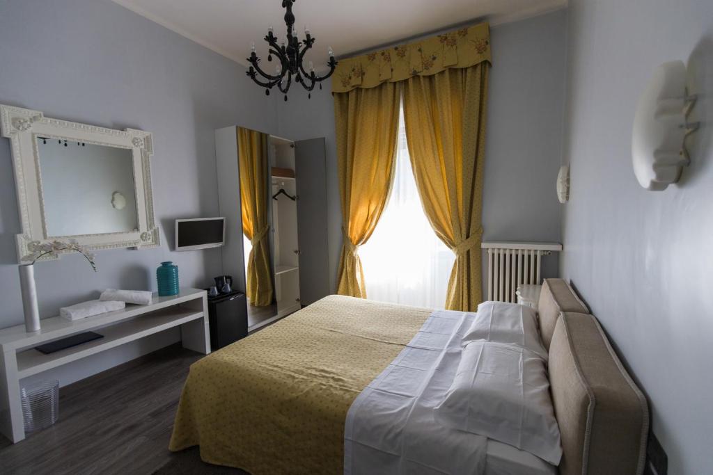Postel nebo postele na pokoji v ubytování Hotel Ponte Sassi