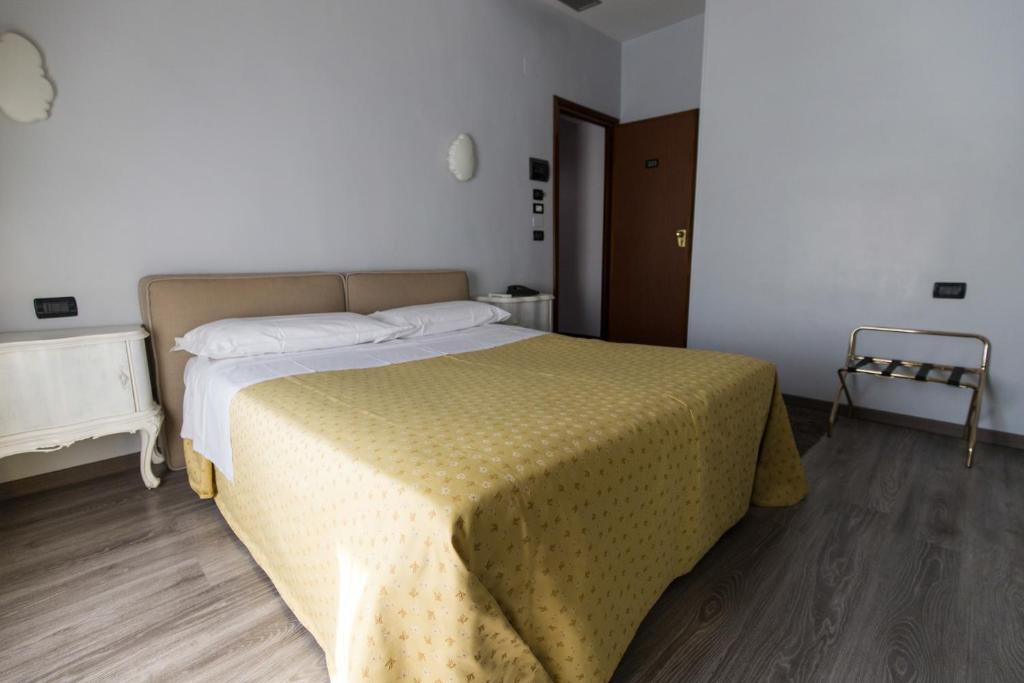 Postel nebo postele na pokoji v ubytování Hotel Ponte Sassi