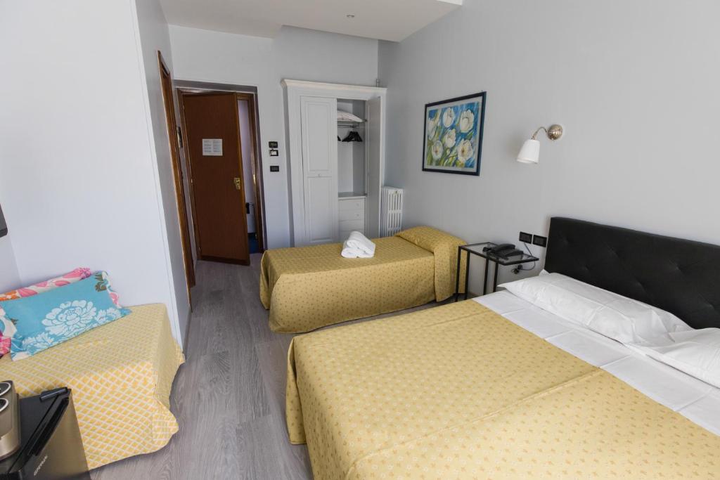 Postel nebo postele na pokoji v ubytování Hotel Ponte Sassi