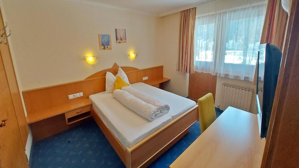 Postel nebo postele na pokoji v ubytování Zeitlos Apartments