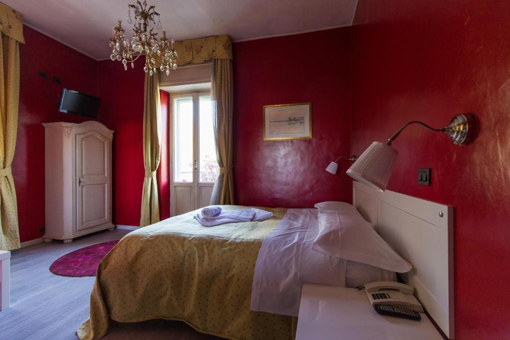 Postel nebo postele na pokoji v ubytování Hotel Ponte Sassi