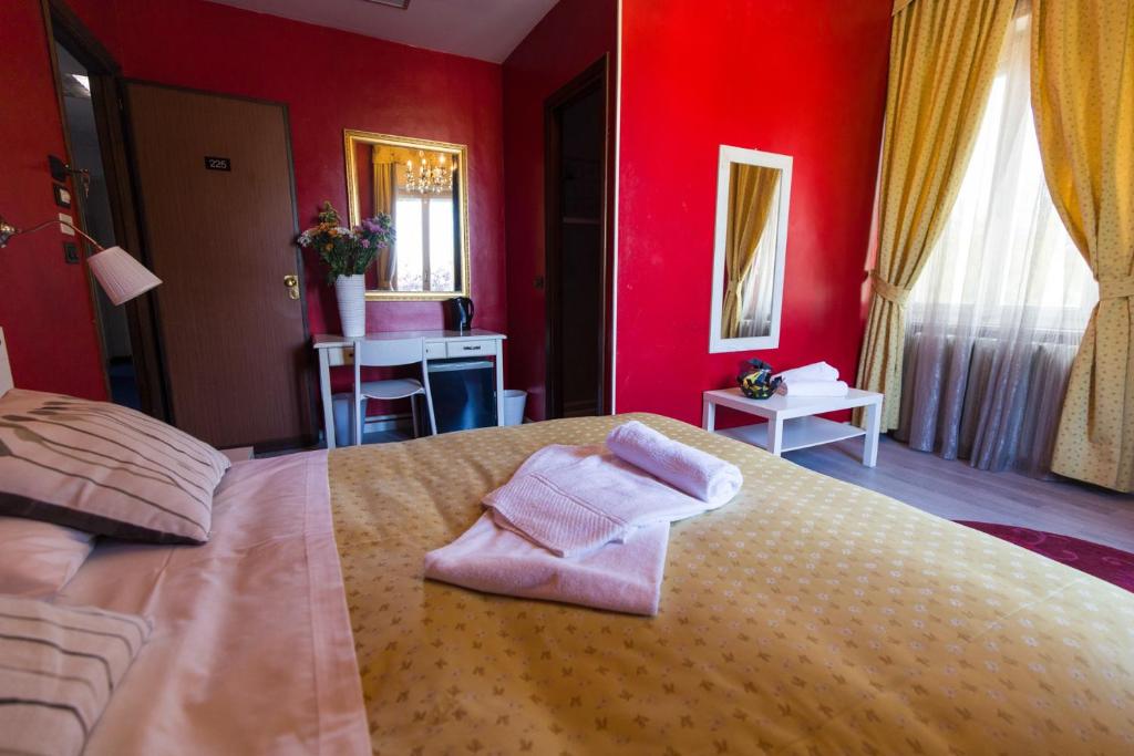 Postel nebo postele na pokoji v ubytování Hotel Ponte Sassi