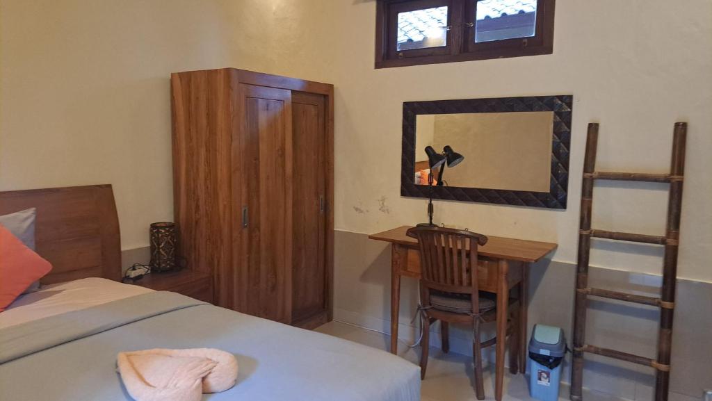 Postel nebo postele na pokoji v ubytování Sahadewa House