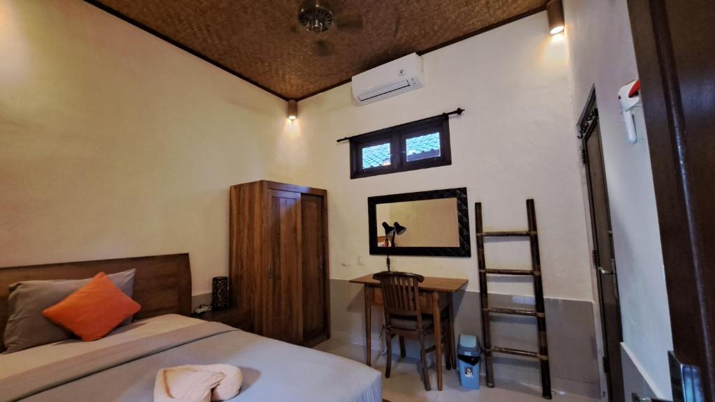 Postel nebo postele na pokoji v ubytování Sahadewa House