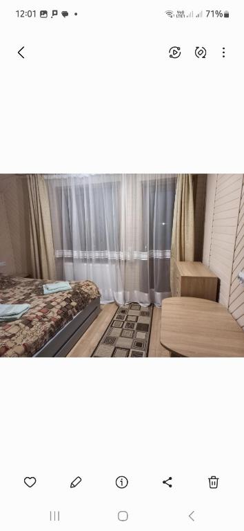 Postel nebo postele na pokoji v ubytování ГОСТИННИЙ ДІМ ЛЕЛИЧ