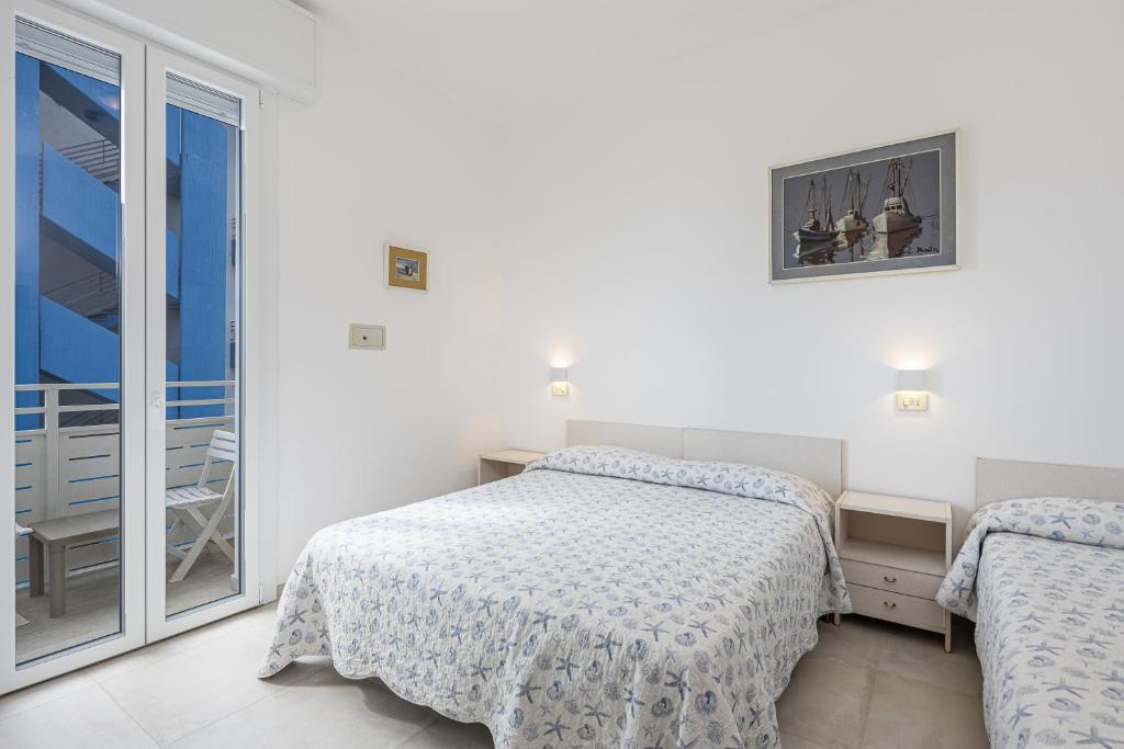 Postel nebo postele na pokoji v ubytování Hotel Flora