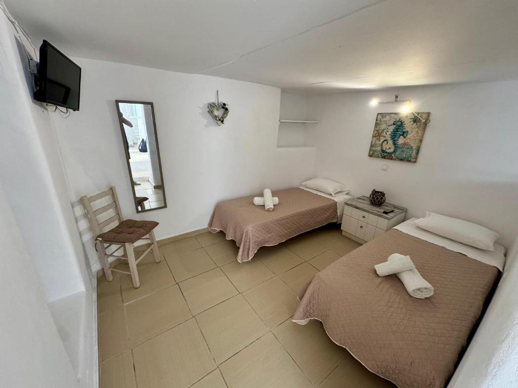 En eller flere senge i et værelse på To spitaki