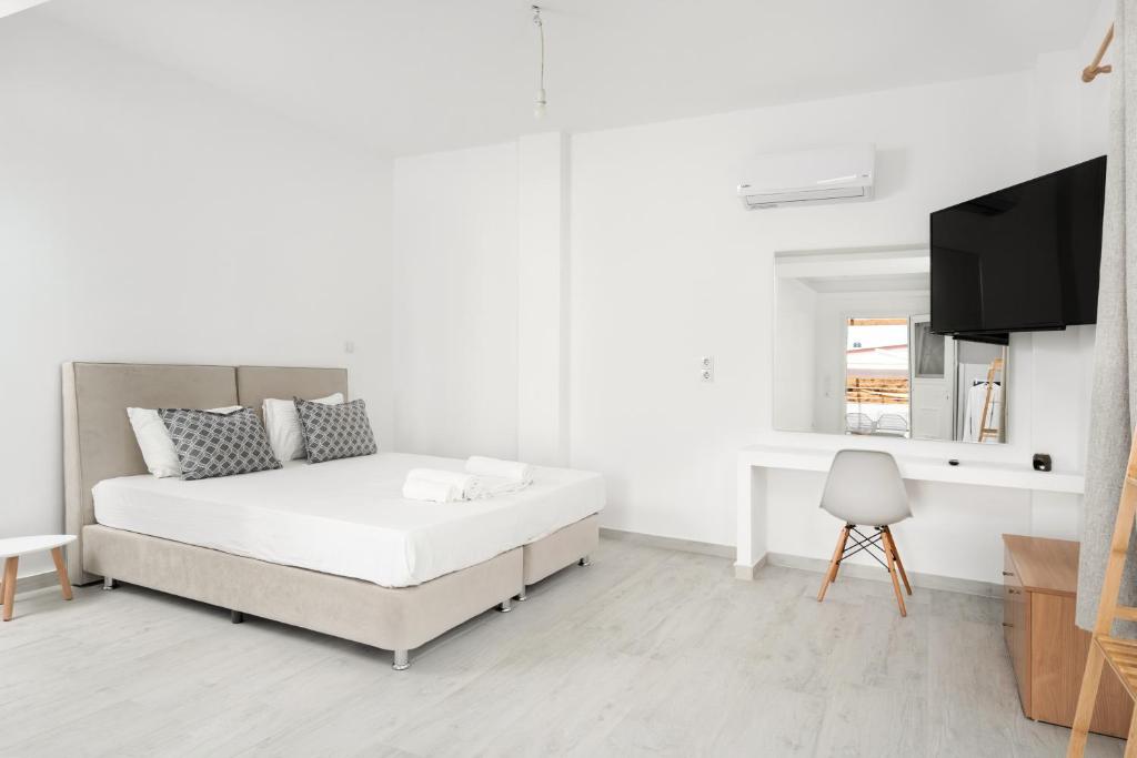 Postel nebo postele na pokoji v ubytování Grozos Rooms