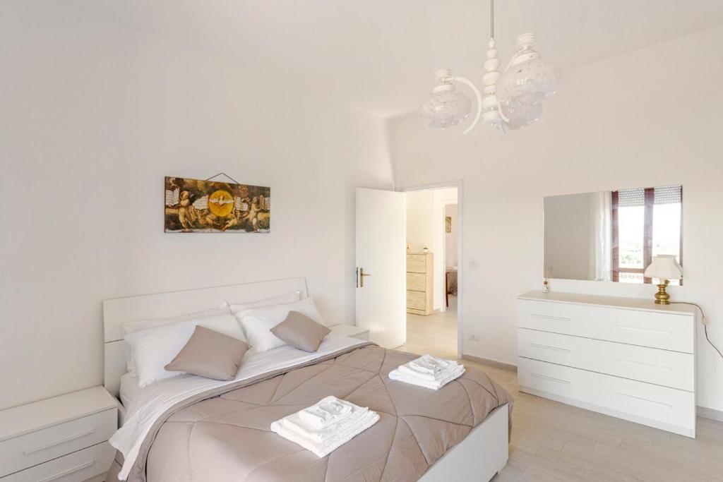 Una cama o camas en una habitación de I Due Gelsi appartamento Wood