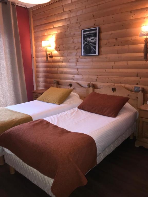 Postel nebo postele na pokoji v ubytování Hôtel La Réserve
