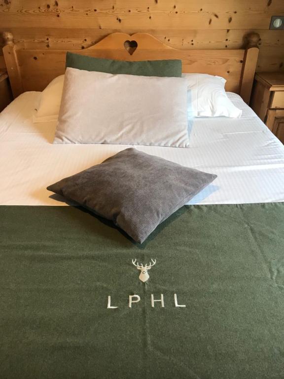 Postel nebo postele na pokoji v ubytování Hôtel La Réserve
