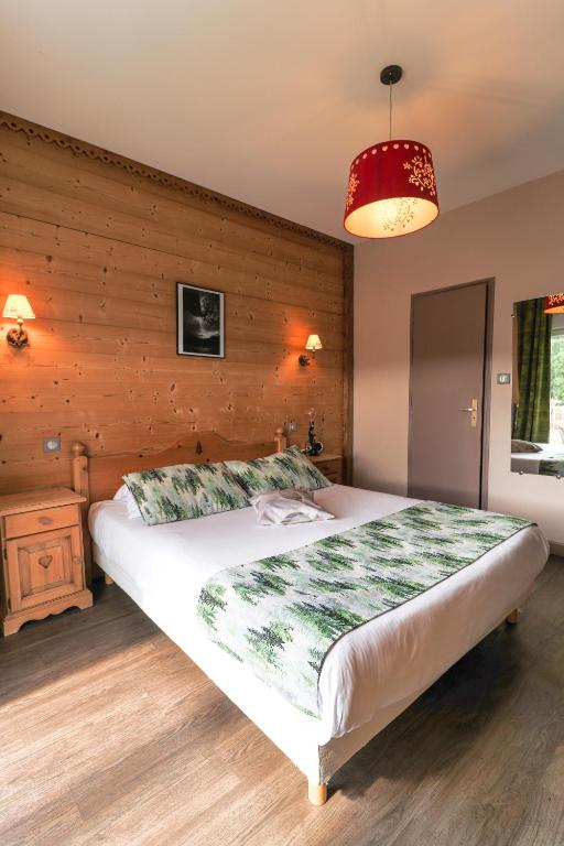 Postel nebo postele na pokoji v ubytování Hôtel La Réserve