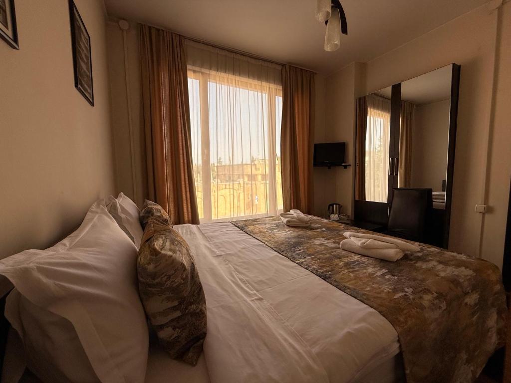 Postel nebo postele na pokoji v ubytování Liva Hotel