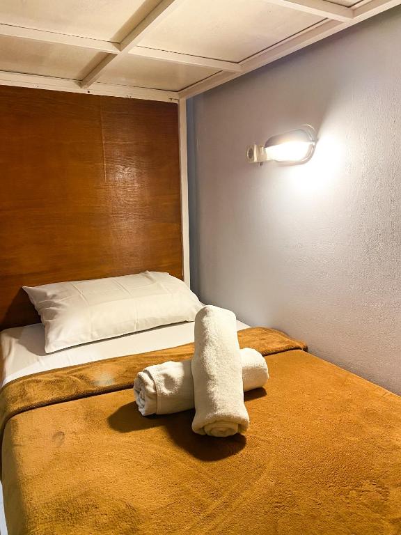 Postel nebo postele na pokoji v ubytování ALA Hostel