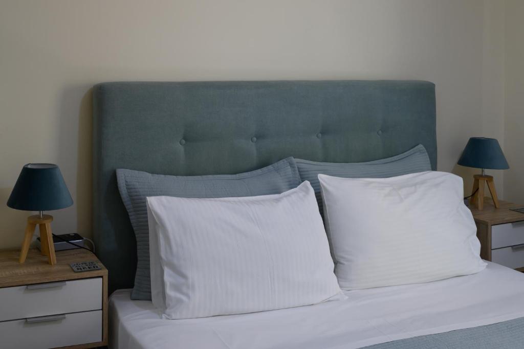 A bed or beds in a room at Koukaki Home