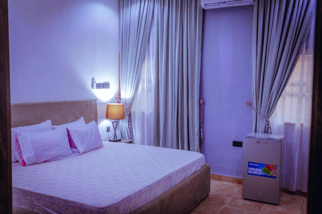 Postel nebo postele na pokoji v ubytování Hannan Residence
