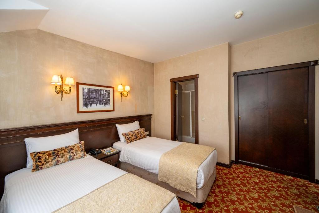 Pera Rose Hotel & SPA HB客房内的一张或多张床位