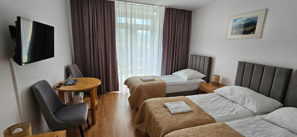 Posteľ alebo postele v izbe v ubytovaní Rewita Kościelisko-Zakopane