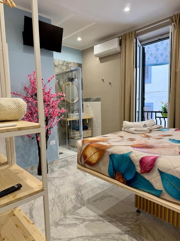 a bedroom with a bunk bed and a window at Experience Napoli Center in Naples