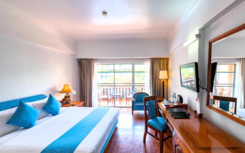 Postel nebo postele na pokoji v ubytování Hotel Somadevi Angkor Resort & Spa