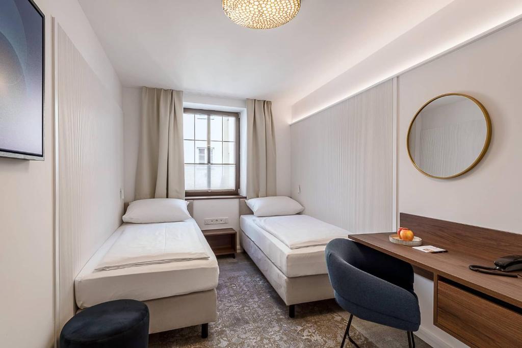 Postel nebo postele na pokoji v ubytování Hotel Mondschein