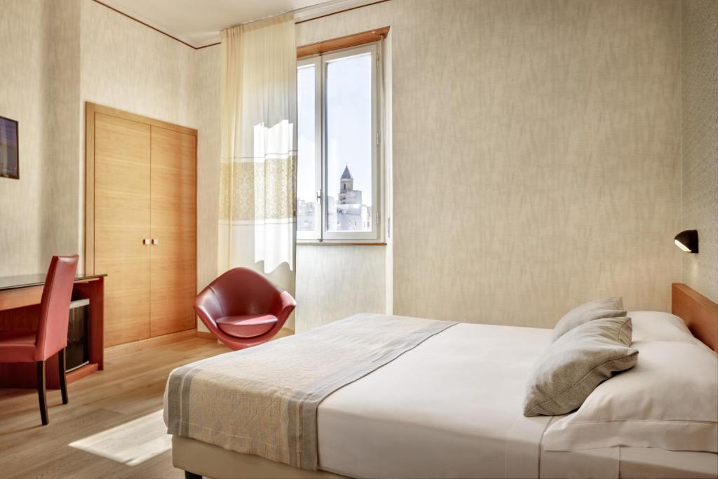 Postel nebo postele na pokoji v ubytování Hotel Italia