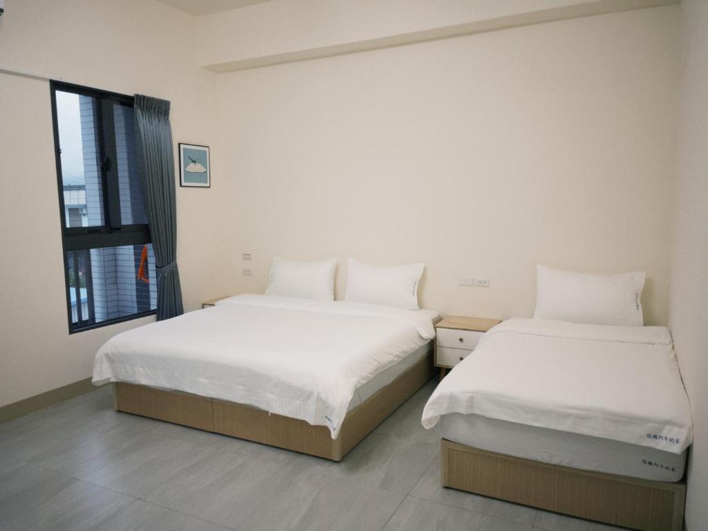 Postel nebo postele na pokoji v ubytování 瑞穗阿牛的家 Rui Sui Moo Guesthouse