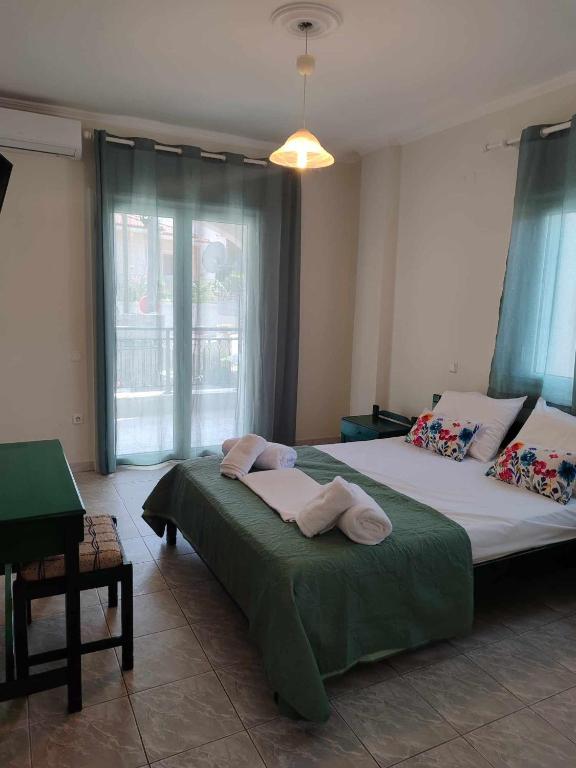 Postel nebo postele na pokoji v ubytování Elite Suites