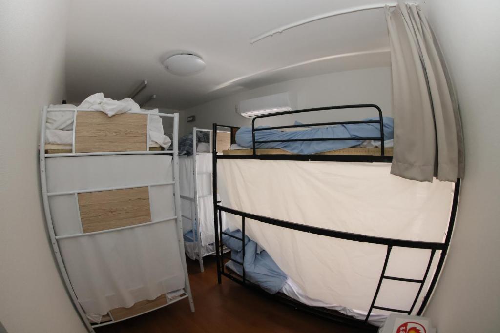 Postel nebo postele na pokoji v ubytování Mount Fuji Omotenashi Guesthouse