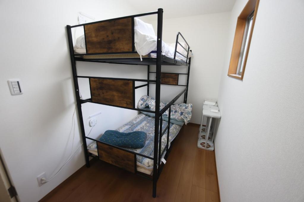 Postel nebo postele na pokoji v ubytování Mount Fuji Omotenashi Guesthouse
