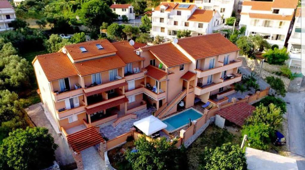 an aerial view of a house with a swimming pool at Del Mar Rab in Kampor