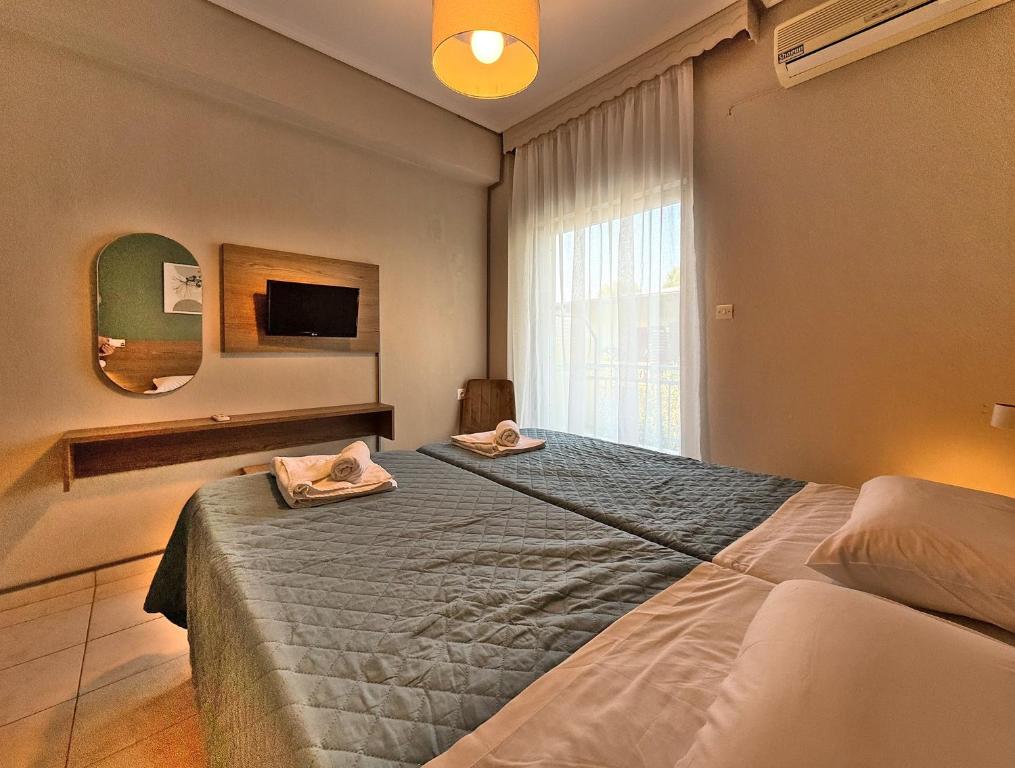Postel nebo postele na pokoji v ubytování Hotel Thermaikos