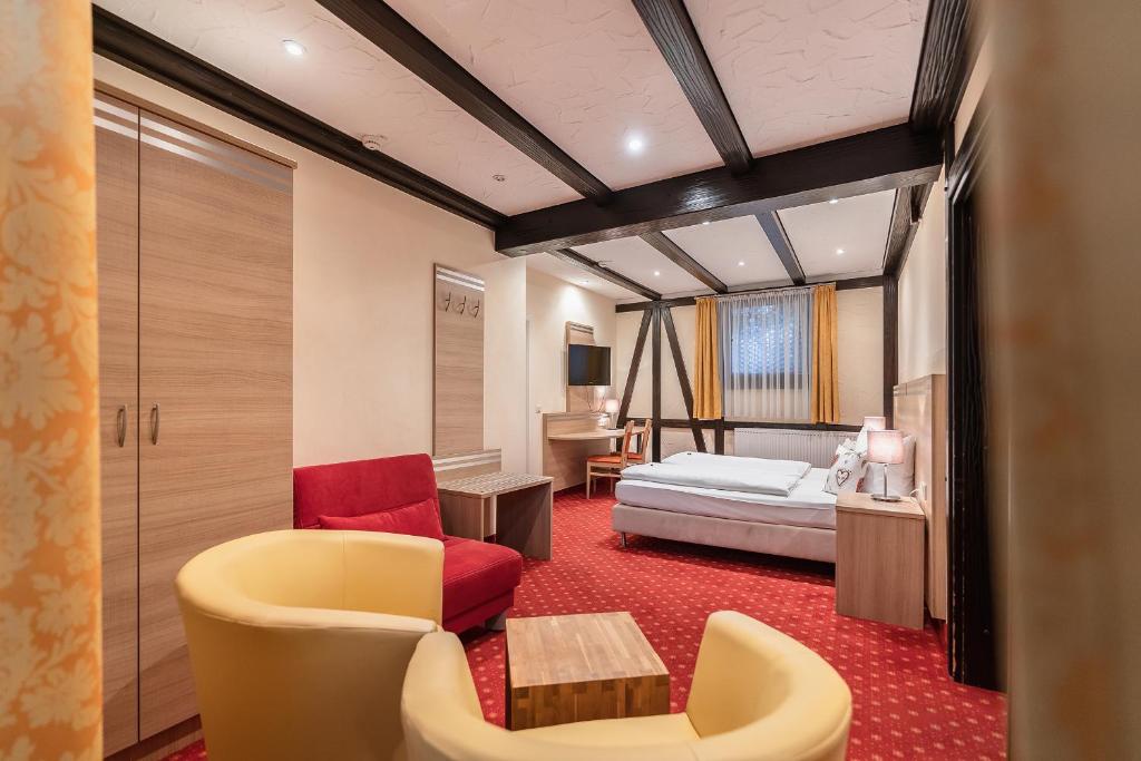 Postel nebo postele na pokoji v ubytování Hotel Altes Weinhaus