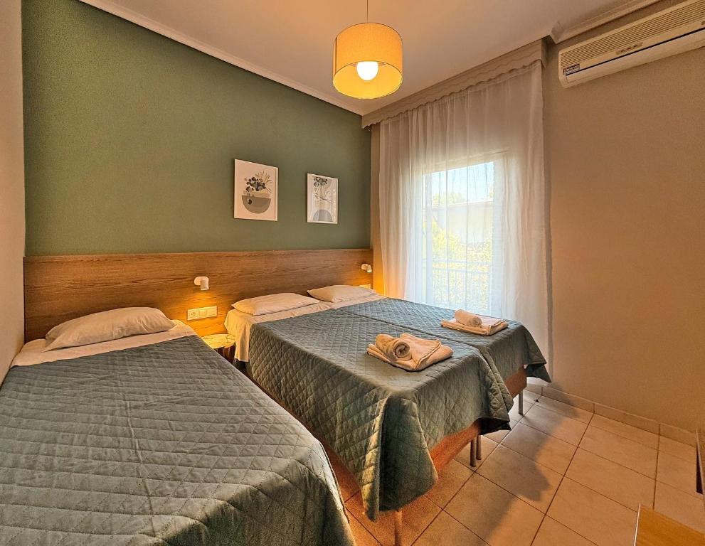 Postel nebo postele na pokoji v ubytování Hotel Thermaikos
